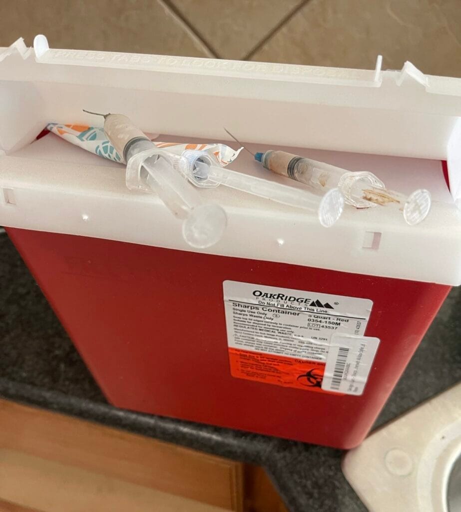 Technician in protective gear performing certified blood cleanup Dallas in a residential setting, ensuring safety and hy